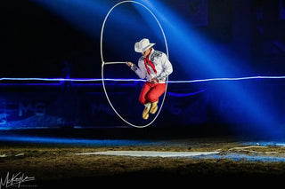Image of Dalton Morris captivating the audience with his impressive Trick Roping Act during the Gascon Horsemanship Never Give Up Tour, showcasing skill and precision in the art of trick roping.
