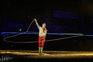 Image of Dalton Morris captivating the audience with his impressive Trick Roping Act during the Gascon Horsemanship Never Give Up Tour, showcasing skill and precision in the art of trick roping.