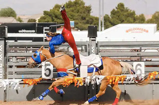 Image of Kelsey Gascon performing during a Trixie Chicks Riders performance, showcasing extraordinary equestrian skills and thrilling tricks.