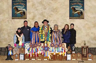 Michael Gascon and his family joyfully posing with their awards, celebrating success at the Grand National Championships