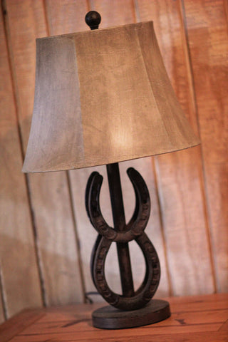 Western-inspired lamp with intricate details, featuring a rustic design reminiscent of traditional western decor.