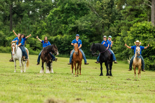 Michael Gascon leading the way on a trail ride with the Horse Help Train-Off contestants, fostering a sense of community and horsemanship exploration during the competition.