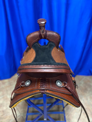 An image featuring an MG custom saddle equipped with a roping horn, designed for roping activities and western riding disciplines.