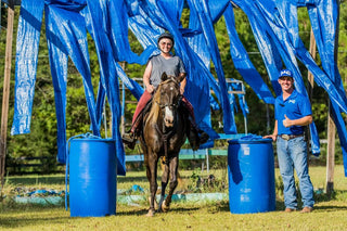 Michael Gascon guiding his student through equestrian obstacles, emphasizing skill development and partnership.