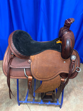 An image featuring an MG custom saddle equipped with a roping horn, designed for roping activities and western riding disciplines.