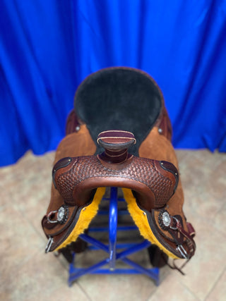 An image featuring an MG custom saddle equipped with a roping horn, designed for roping activities and western riding disciplines.