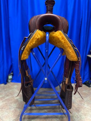 An image featuring an MG custom saddle equipped with a roping horn, designed for roping activities and western riding disciplines.