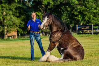 A Horse Help Train-Off contestant striking a pose with her horse, showcasing the bond and teamwork cultivated through the training program.