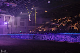 Image of Aurelia Wallenda-Zoppe performing her mesmerizing Aerial Act during the Gascon Horsemanship Never Give Up Tour, showcasing grace, skill, and adding a breathtaking aerial dimension to the equestrian spectacle.