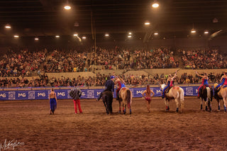 Image of Michael and Kelsey Gascon alongside other performers during the Gascon Horsemanship Never Give Up Tour, capturing the camaraderie and teamwork behind the scenes of this captivating equestrian event.