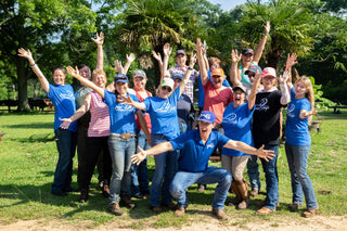 Michael Gascon posing with a group of clients during a Horse Help retreat, fostering community and learning in an equestrian setting.