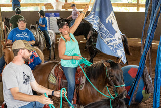 Image of a retreat participant diligently working on her horsemanship skills with her horse in the arena, showcasing dedication and focused learning during the retreat experience.