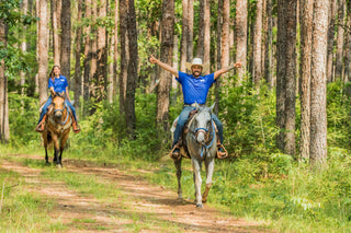 Horse Help Train-Off contestants enjoying a trail ride, showcasing their horsemanship skills and camaraderie during the competition.