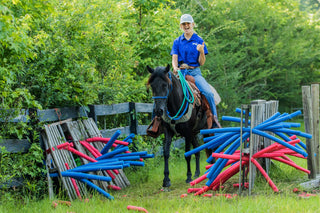 Image of a Horse Help Train-Off contestant confidently navigating through the obstacle course, demonstrating skill and determination.