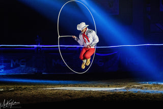 Image of Dalton Morris captivating the audience with his impressive Trick Roping Act during the Gascon Horsemanship Never Give Up Tour, showcasing skill and precision in the art of trick roping.