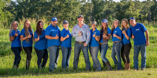 Michael and Kelsey Gascon posing with the Horse Help team, showcasing collaboration and camaraderie in their dedication to equestrian education and horsemanship.