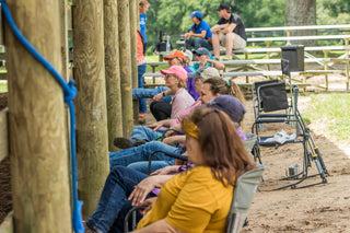 Image of participants and auditors immersed in enjoyment during a Gascon horsemanship clinic session, capturing the positive atmosphere and shared learning experience in the clinic.