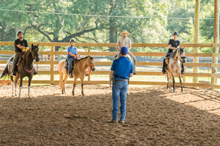 Michael Gascon providing instruction and guidance while teaching clients during a Gascon horsemanship clinic.