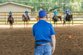 Michael Gascon providing instruction and guidance while teaching clients during a Gascon horsemanship clinic.