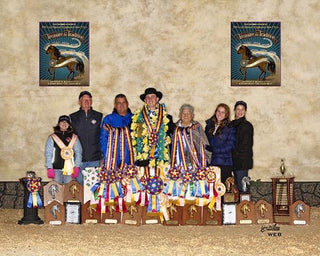 Michael Gascon and his family joyfully posing with their awards, celebrating success at the Grand National Championships