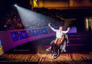 Image of Michael Gascon and his horse Tito delivering a captivating performance during the Gascon Horsemanship Never Give Up Tour, showcasing a strong bond and skillful horsemanship in a dynamic and engaging display.