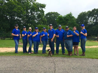 Michael Gascon posing with enthusiastic aspiring trainers from the Horse Help Academy, fostering a mentorship and learning environment in equine education.