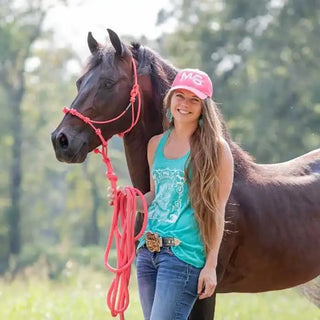 Kelsey Gascon, wife of Michael Gascon and CEO of Gascon Horsemanship’s Training Facility & Academy. A professional trick rider and accomplished horse trainer, she brings expertise and passion to the world of horsemanship.