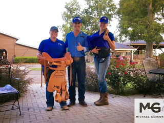 Image of Michael Gascon posing with a pair of aspiring trainers, capturing a moment of mentorship and shared passion for horsemanship.