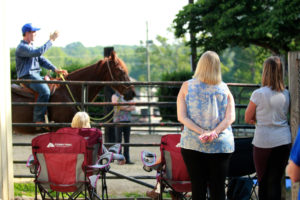 Michael Gascon actively teaching participants and auditors during a Gascon horsemanship clinic, sharing knowledge and skills in equestrian training.