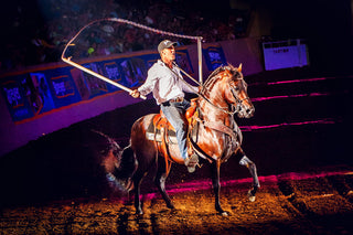 Image of Michael Gascon and his horse Tito delivering a captivating performance during the Gascon Horsemanship Never Give Up Tour, showcasing a strong bond and skillful horsemanship in a dynamic and engaging display.