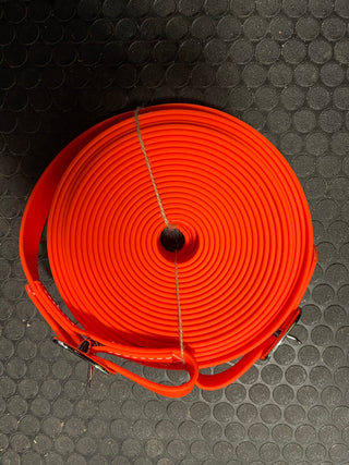 Orange MG Biothane Driving Lines: High-quality Biothane driving lines in vibrant blue color, designed for durability and flexibility. Perfect for practicing driving skills learned from Michael Gascon, the Horse Guru, during Horse Help training sessions.