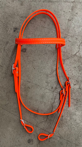 MG Biothane Headstall in orange color, showcasing the durable and weather-resistant material. The image displays the headstall's sleek design, highlighting its versatility and suitability for various equestrian activities.