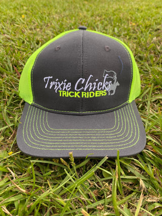 A black Trixie Chicks Trick Riders cap with green accents, featuring a stylish design and vibrant colors, ideal for trick riding enthusiasts