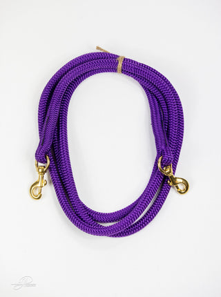 Purple MG reins, essential horse tack for communication and control while riding.