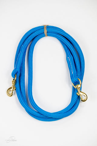 Blue  MG reins, essential horse tack for communication and control while riding.