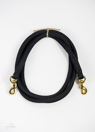 Black MG reins, essential horse tack for communication and control while riding.